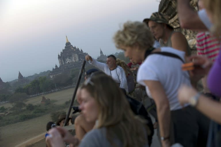 Tourists wait for sunset over the pagodas in Myanmar's northern ancient town of Bagan