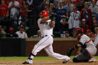 ARLINGTON, TX - OCTOBER 24: Mike Napoli #25 of the Texas Rangers hits a two-run double in the eighth inning during Game Five of the MLB World Series against the St. Louis Cardinals at Rangers Ballpark in Arlington on October 24, 2011 in Arlington, Texas. (Photo by Tom Pennington/Getty Images)