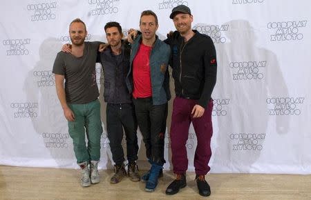 FILE PHOTO: British band Coldplay members Will Champion,Guy Berryman, Chris Martin and Jonny Buckland (L-R) pose for photographers during a photocall for the presentation of their new album "Mylo Xyloto" in Madrid October 26, 2011. REUTERS/Juan Medina/File Photo