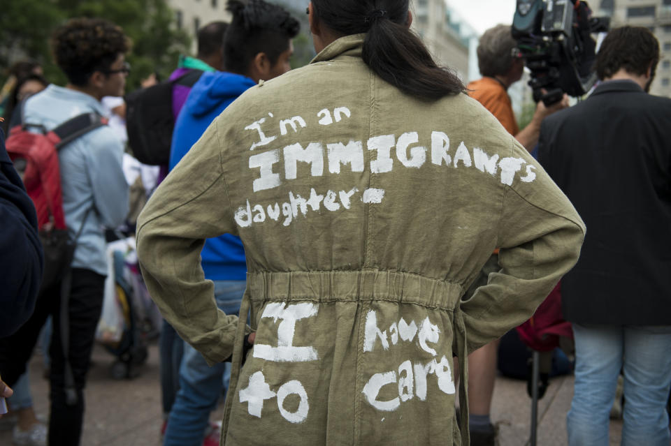 <p>A girl wears a jacket that references that of the First Lady Melania Trump during a CASA in Action rally at Freedom Plaza in downtown Washington, D.C. The protest was organized to protest the Trump Administration zero tolerance policy that separates children from their families at the southern border Wednesday June 27, 2018. (Photo: Sarah Silbiger/CQ Roll Call/Getty Images) </p>