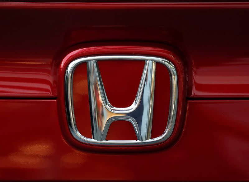 Honda Motor's logo is seen on Civic sedan car at its showroom in Tokyo