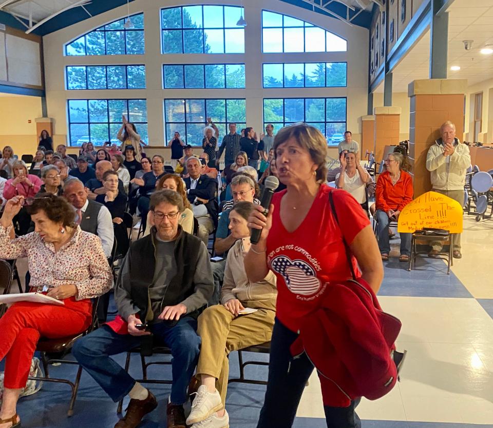 Exeter's Greta Peeke grabbed a microphone and interrupted the SAU 16 Joint Board meeting Monday, June 14, 2021, yelling the district was teaching students to "hate America."