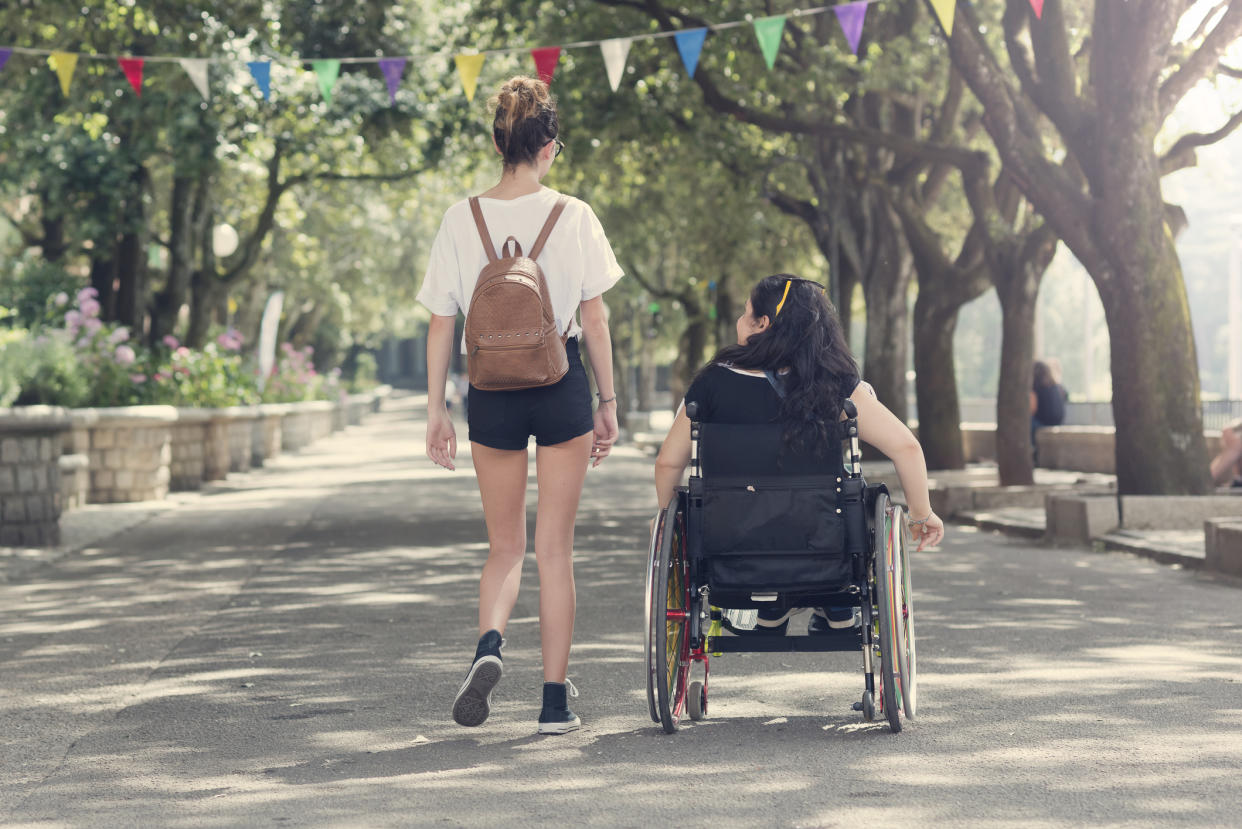 A woman was mocked for standing up without her wheelchair [Photo: Getty]