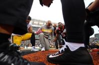 Oct 14, 2018; Cincinnati, OH, USA; Pittsburgh Steelers Ryan Shazier (middle) joins members of Steelers and Bengals at Paul Brown Stadium. Mandatory Credit: Aaron Doster-USA TODAY Sports