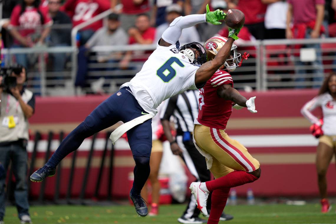 Seattle Seahawks safety Quandre Diggs, left, breaks up a pass intended for San Francisco 49ers wide receiver Danny Gray during the first half of an NFL football game in Santa Clara, Calif., Sunday, Sept. 18, 2022. (AP Photo/Tony Avelar)