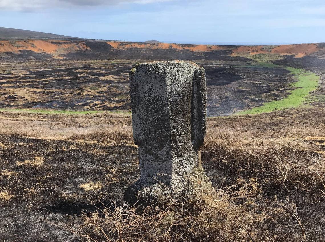 The remains of an Easter Island head overlooking the fire-scorched crater.