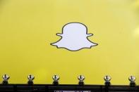 A billboard displays the logo of Snapchat above Times Square in New York March 12, 2015. REUTERS/Lucas Jackson/Files