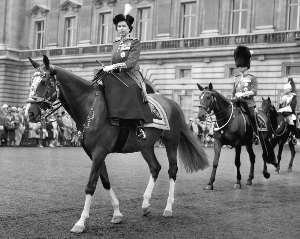Queen Elizabeth II, rides out from Buckingham Palace, London to take the salute at the ceremony of Trooping the Colour, followed by Prince Philip and the Duke of Gloucester, the Queen's uncle, June 15, 1960. (AP Photo)