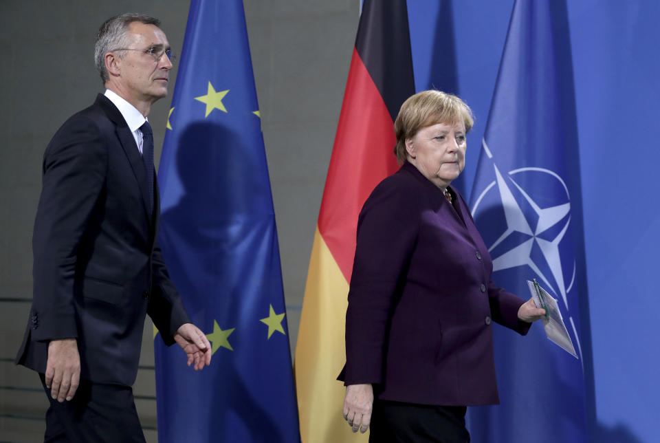 German Chancellor Angela Merkel, right, and NATO Secretary General Jens Stoltenberg, left, arrive for a press conference after a meeting at the Chancellery in Berlin, Germany, Thursday, Nov. 7, 2019. (AP Photo/Michael Sohn)