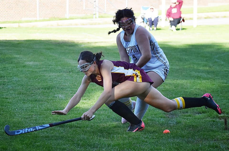 Westport's Molly Bazinet, right, looks for the ball.
