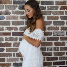 <p>The stunning mother wore a white tassel dress designed by Judy Copley Couture and shots were taken by photographer Shot With Carolin. Stunning.</p>