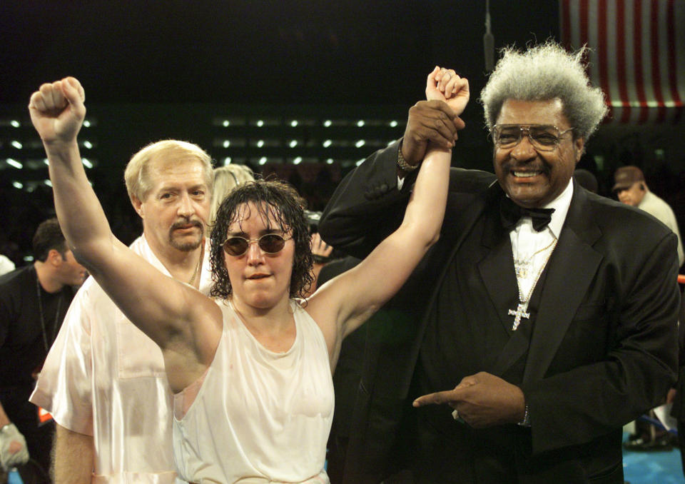 3 Mar 2000:  Promoter Don King holds up the arm of Christy Martin after defeating Belinda Laracuente by way of unanimous decision after 8 rounds during their Women''s WBC Championship bout at Caesars Palace in Las Vegas, Nevada.  <<DIGITAL IMAGE>>   Mandatory Credit: Jed Jacobsohn/ALLSPORT