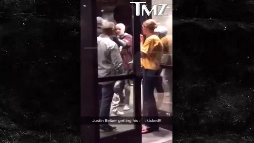 Justin Bieber can clearly be seen in the red hoodie. Source: TMZ