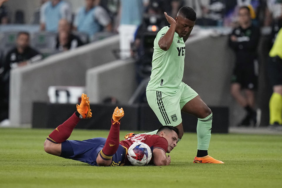 Real Salt Lake forward Rubio Rubin falls next to Austin FC midfielder Jhojan Valencia during the first half of an MLS soccer match in Austin, Texas, Saturday, June 3, 2023. (AP Photo/Eric Gay)