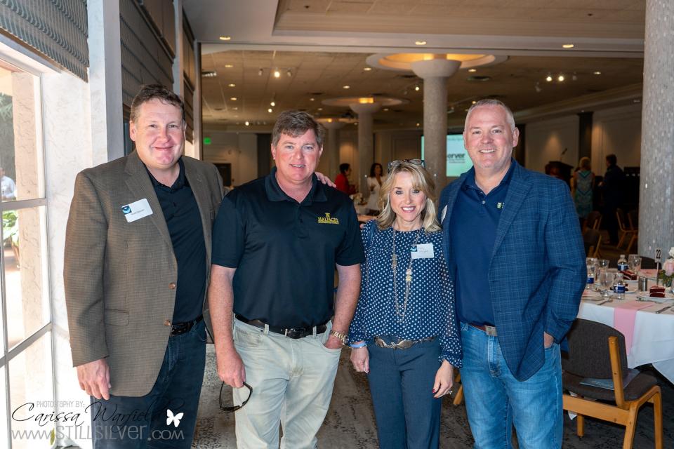 Keith Mercier, CBIZ, left; Jack Cox, Halfacre Construction Co.; and Holly Wright and Patrick Wright, CBIZ, at the Caring Hearts event.