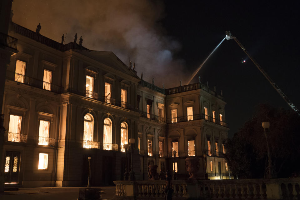 Firefighters work the fire at the 200-year-old National Museum of Brazil, in Rio de Janeiro, Brazil, Sunday, Sept. 2, 2018. According to its website, the museum has thousands of items related to the history of Brazil and other countries. The museum is part of the Federal University of Rio de Janeiro. (AP Photo/Leo Correa)