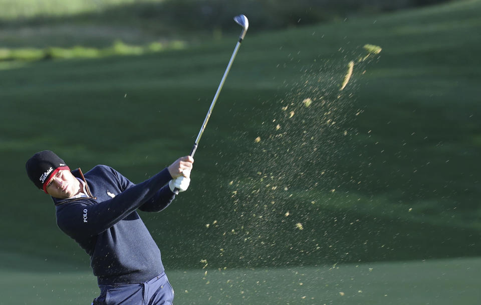 Justin Thomas of the United States blasts a shot on the 10th hole during the first round of the CJ Cup PGA golf tournament at Nine Bridges on Jeju Island, South Korea, Thursday, Oct. 18, 2018. (Park Ji-ho/Yonhap via AP)