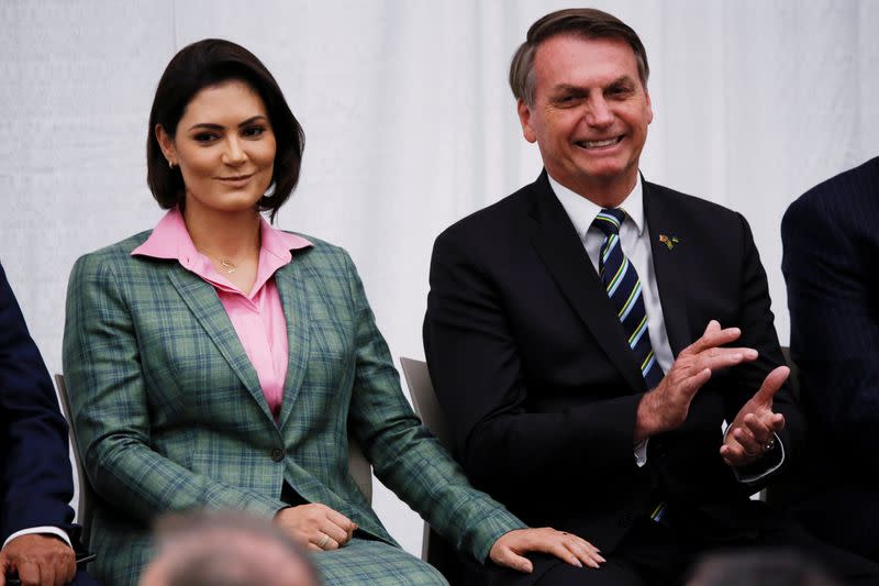 Brazilian President Jair Bolsonaro and his wife Michelle Bolsonaro attend a meeting with the Brazilian community at The Miami Dade College Auditorium, in Miami