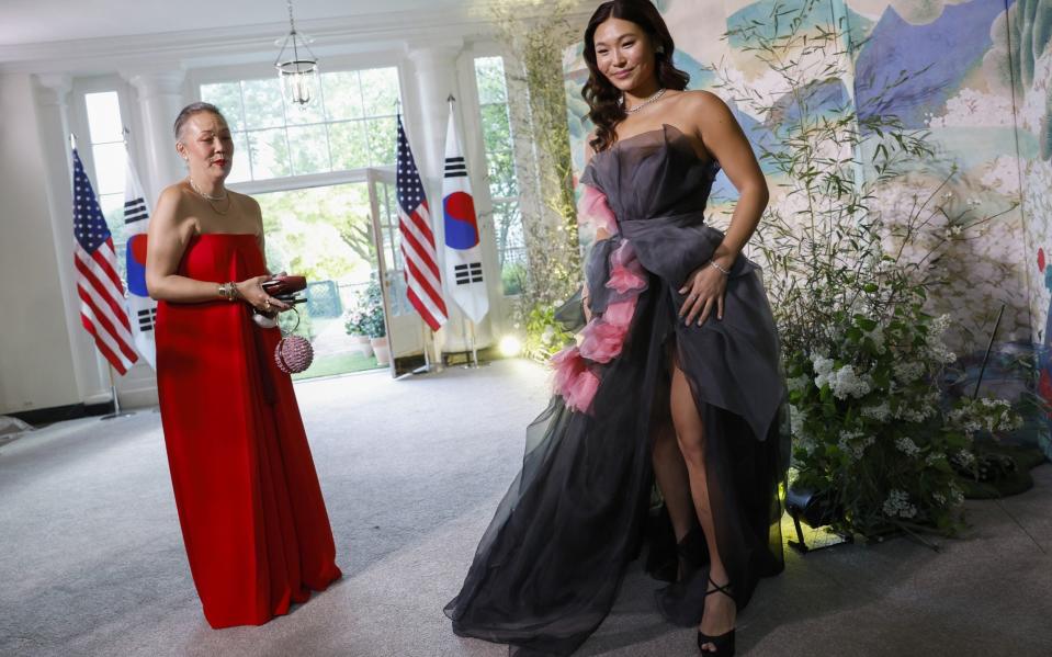 Olympic snowboard champion Chloe Kim wears a flowing grey dress to the state dinner - Anna Moneymaker/Getty Images