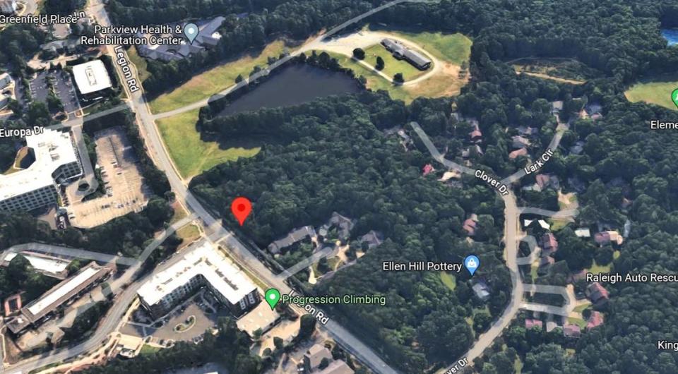Longleaf Trace, an affordable apartment building proposed for Legion Road in Chapel Hill, would replace a largely wooded lot (red marker) and two single-family rental homes. The site is south of the town’s Legion Road park and affordable housing site.