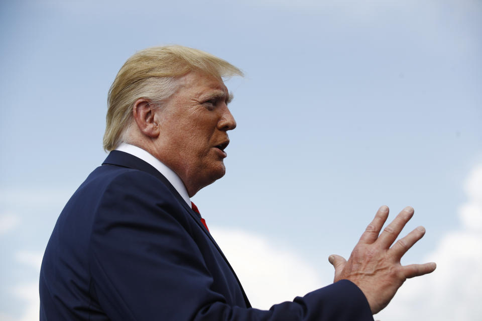 President Donald Trump speaks with reporters before boarding Air Force One at Morristown Municipal Airport in Morristown, N.J., Sunday, Aug. 18, 2019. (AP Photo/Patrick Semansky)