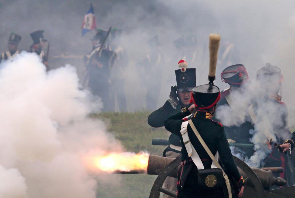 Members of historic clubs wearing 1812-era uniforms take part in a staged battle re-enactment to mark the 200th anniversary of the battle of Borodino, in Borodino, about 110 km (70 miles) west of Moscow, Sunday, Sept. 2, 2012. The Battle of Borodino in 1812 was the largest and bloodiest single-day action of the French invasion of Russia. (AP Photo/Mikhail Metzel)