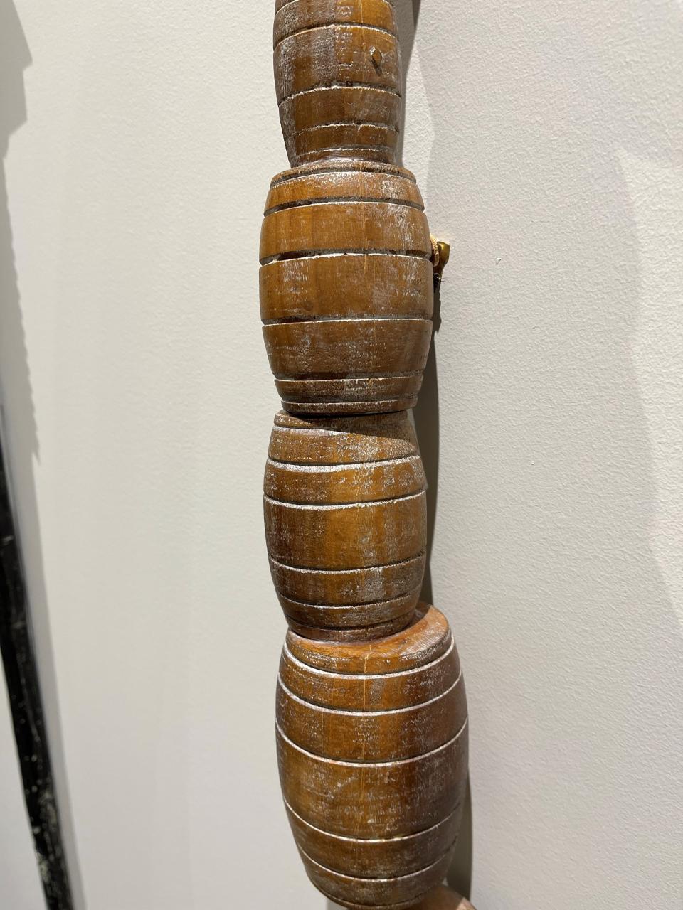 Wooden walking sticks, commissioned from local artists and used to create tree guards on Main Street in 1995, are displayed in the offices of Leadership Louisville.