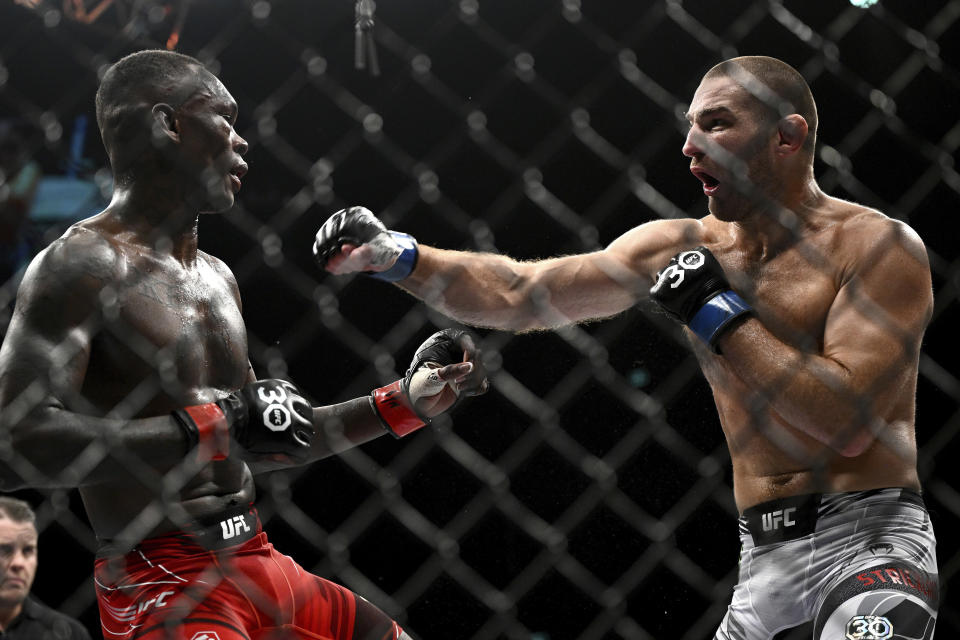 American Sean Strickland, right, and Nigerian-born New Zealander Israel Adesanya battle in the middleweight title bout in the main event of UFC 293 in Sydney, Sunday, Sept. 10, 2023. (Dan Himbrechts/AAP Image via AP)