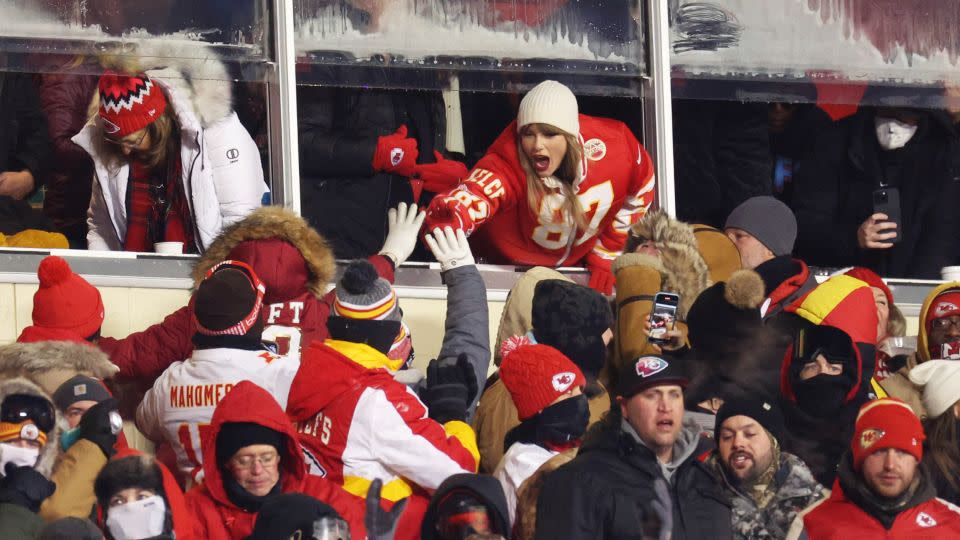 Taylor Swift celebrates with fans at the Dolphins-Chiefs football game in Kansas City in January. - Jamie Squire/Getty Images