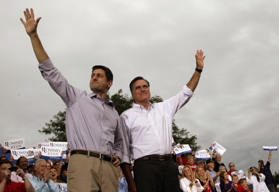 Republican presidential candidate, former Massachusetts Gov. Mitt Romney, right, and vice presidential running mate Rep. Paul Ryan of Wisconsin, greet the crowd during a campaign event at the Waukesha County Expo Center, Sunday, Aug. 12, 2012, in Waukesha, Wis. (AP Photo/Mary Altaffer)