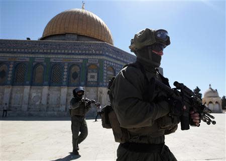 Israeli policemen react in clashes with Palestinians on the compound known to Muslims as the Noble Sanctuary and to Jews as the Temple Mount in Jerusalem's Old City September 6, 2013. REUTERS/ Ammar Awad