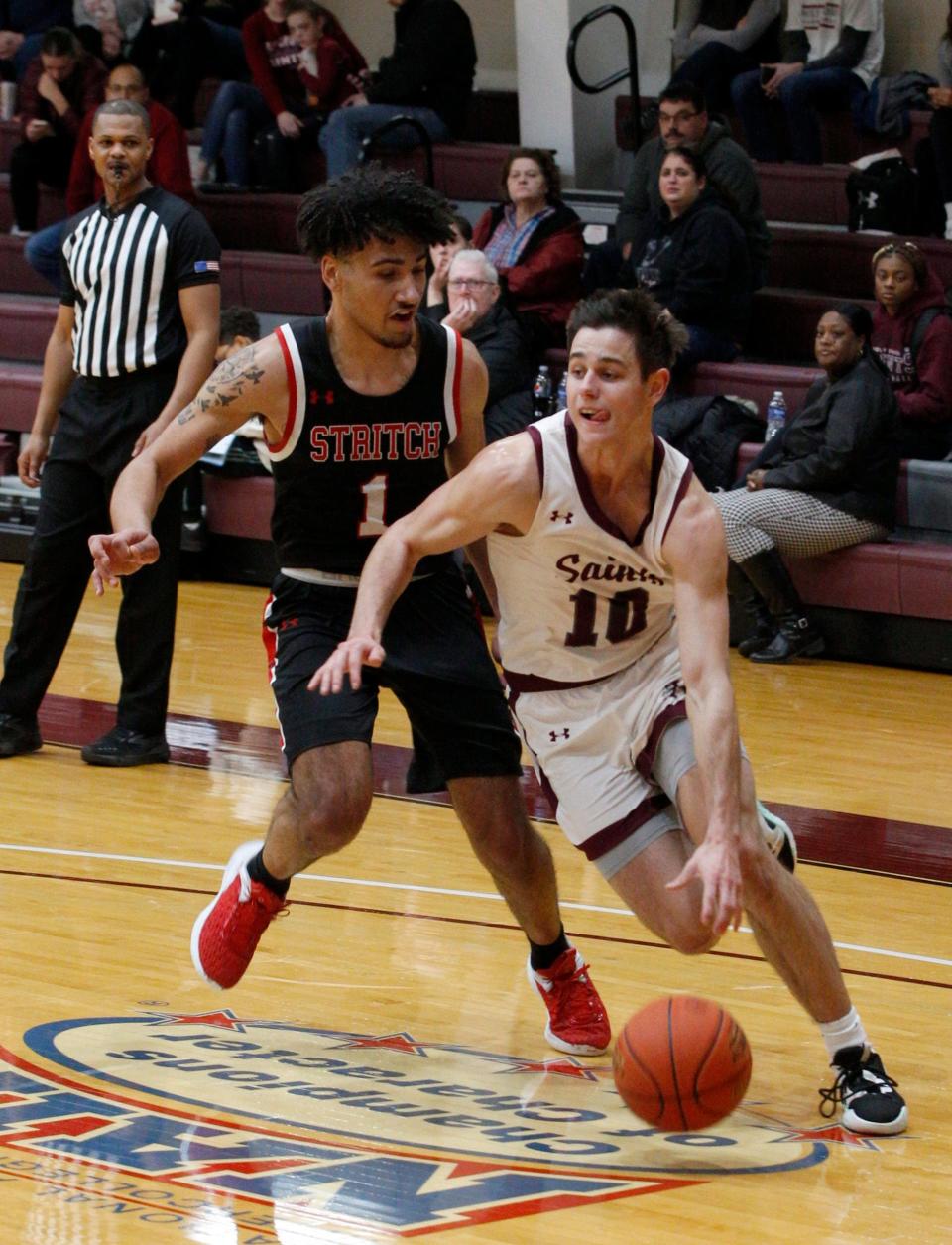 Beau Ludwick (10) of Holy Cross drives against Cardinal Stritch University, Jan. 15, 2023 in South Bend.
(Photo: Michael Wanbaugh, South Bend Tribune)