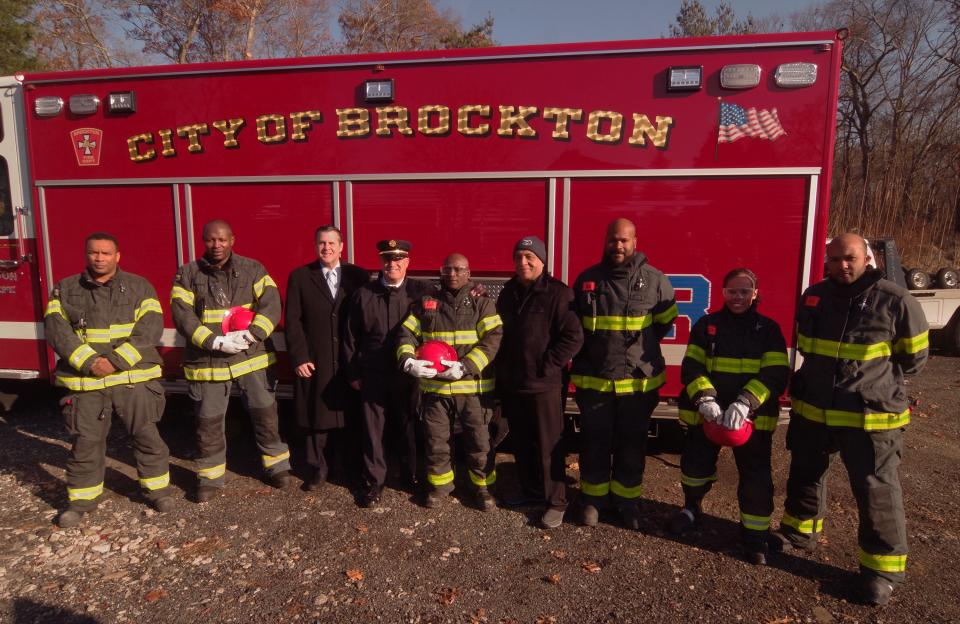 Members of the Praia Cape Verde Fire Department stand Brockton city officials while at the fire training at Everett's Auto Parts in Brockton on Thursday, Nov. 30, 2023. From left to right: Brockton Firefighter Helio Lima, a native of Cape Verde; Praia Firefighter Osvaldino Semedo; Brockton Mayor Robert Sullivan; Brockton Fire Chief Brian Nardelli; Praia Cape Verde Fire Chief Carlos Teixeira; Brockton Councilor-at-large Moses Rodrigues; Praia Deputy Fire Chief Ronaldo Varela; Praia Firefighter Carmen DeCarvalho; and Praia Firefighter Bruno Rodrigues.