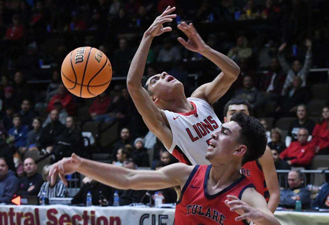 Tulare Western’s Carmine Ficher, foreground, blocks Kerman’s Mario Herrea, background, at the CIF Central Section Division IV basketball championship Friday, Feb. 24, 2023 in Fresno.