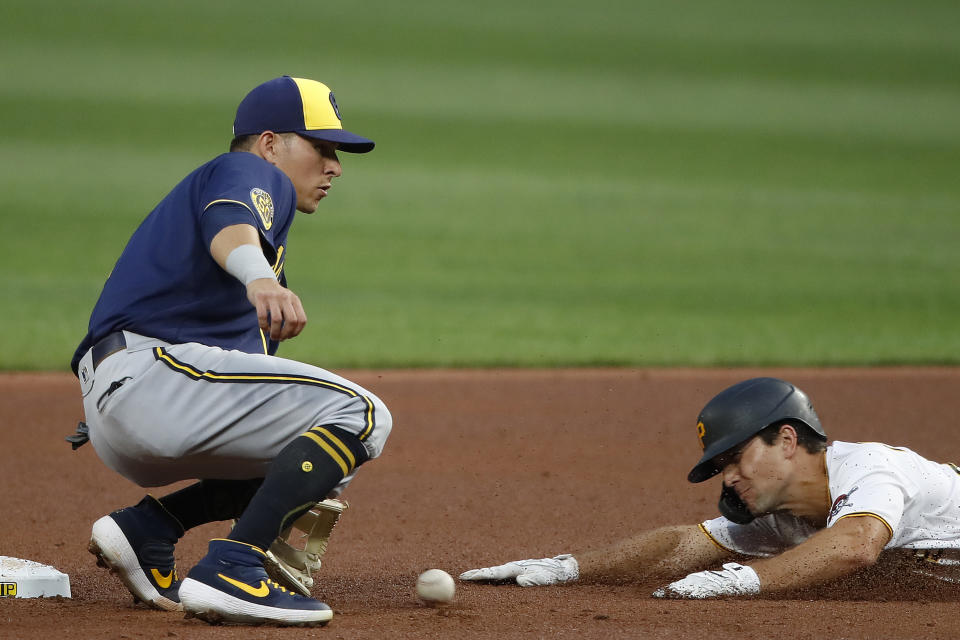 CORRECTS PLAYER AT LEFT TO SECOND BASEMAN LUIS URIAS INSTEAD OF SHORTSTOP ORLANDO ARCIA - Milwaukee Brewers second baseman Luis Urias, left, gets the throw from catcher Omar Narvaez in time to tag out Pittsburgh Pirates' Adam Frazier who was attempting to steal second base in the second inning of a baseball game in Pittsburgh, Friday, Aug. 21, 2020. (AP Photo/Gene J. Puskar)