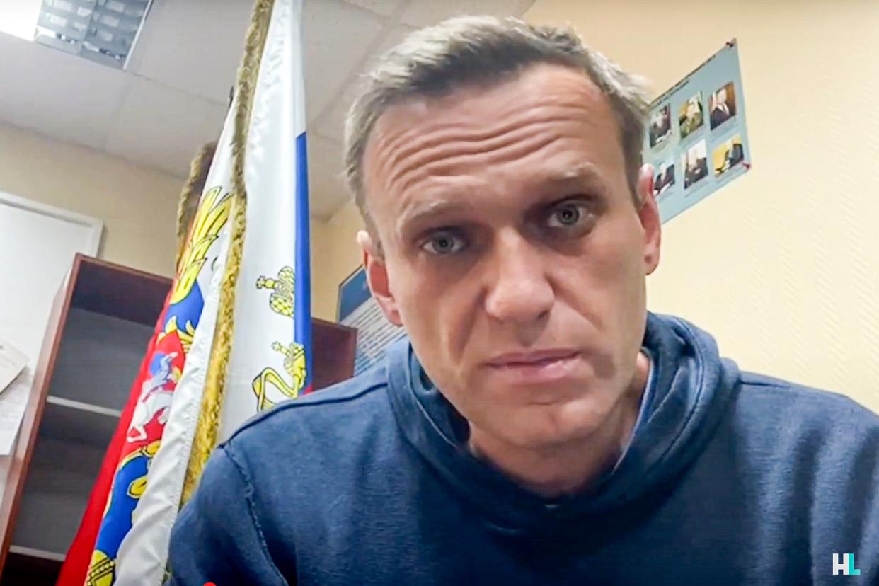 In this image taken from video released by Navalny Life youtube channel, Russian opposition leader Alexei Navalny speaks as he waits for a court hearing in a police station in Khimki (AP)