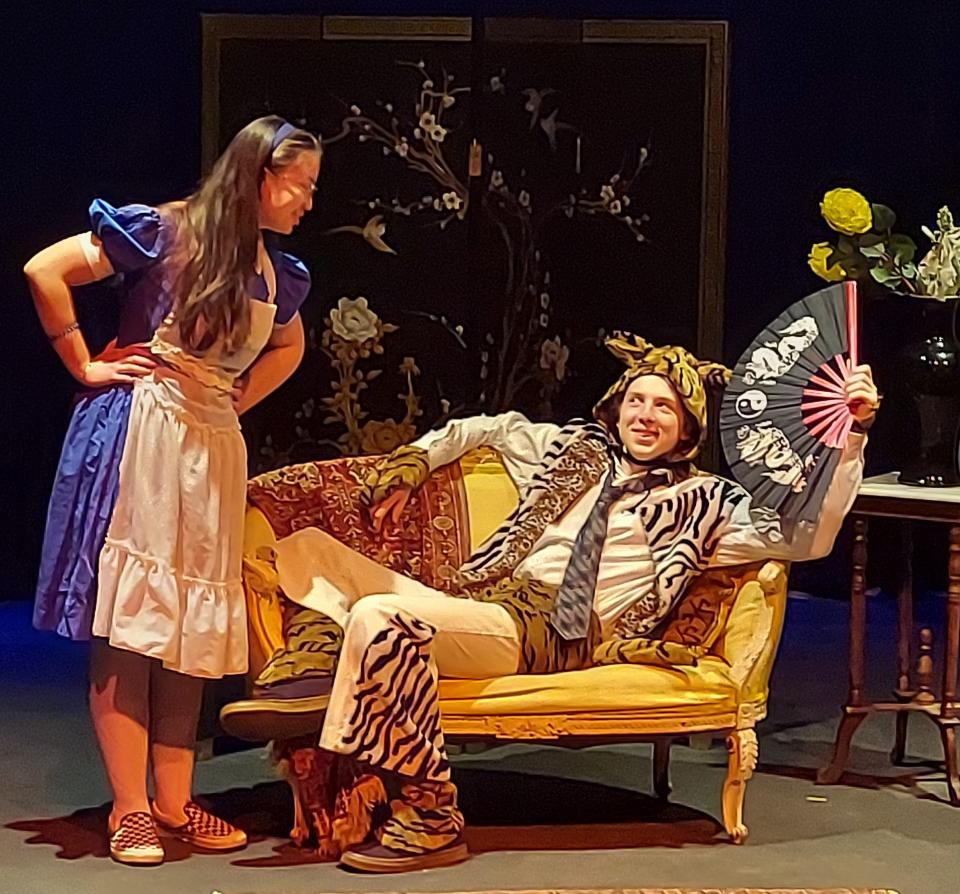 Xevi Parker as Alice, left, and John O'Meara as The Cheshire Cat in the Academy of Performing Arts production of "Alice in Wonderland."