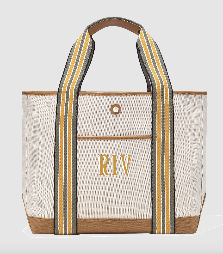 large canvas tote with yellow striped handles and the initials "RIV"