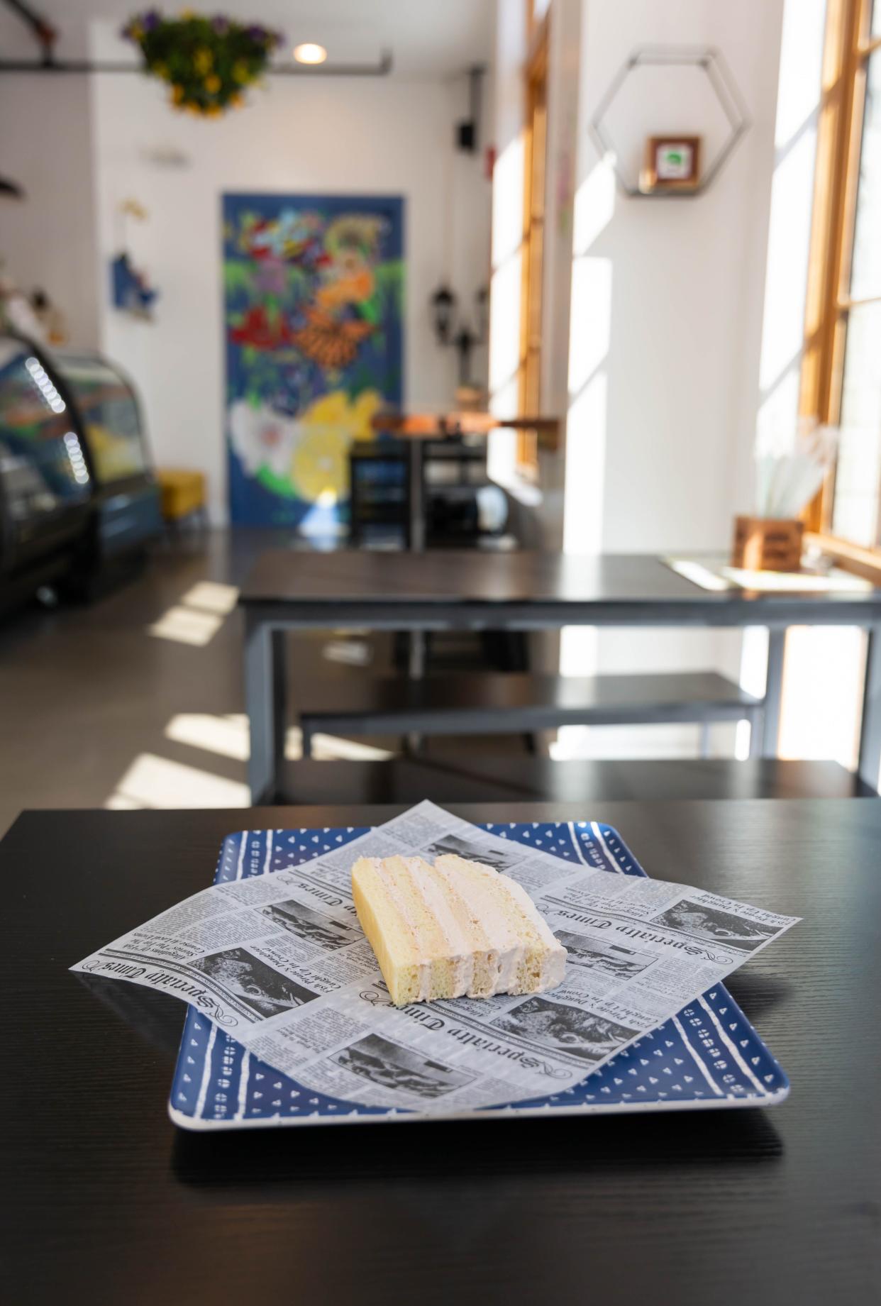 A slice of seven layer cake sits on a table at Sweet Patricia's Bakery.