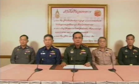 In this file still image taken from video, Thailand's army chief General Prayuth Chan-ocha (C) announces on national television that the military has seized power May 22, 2014. REUTERS/Thai TV Pool via Reuters TV/Files