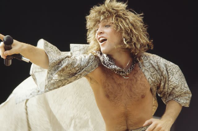 <p>Koh Hasebe/Shinko Music/Getty</p> Jon Bon Jovi performing in Japan in August 1984