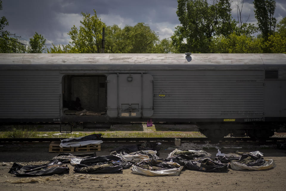 Bodies of dead Russian soldiers lay on the floor during an identification process in Kharkiv, east Ukraine, Tuesday, May 17, 2022. (AP Photo/Bernat Armangue)