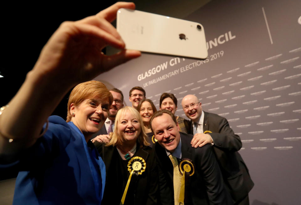 First Minister Nicola Sturgeon takes a selfie with her newly elected MPs at the SEC Centre in Glasgow after counting for the 2019 General Election. (Photo by Andrew Milligan/PA Images via Getty Images)