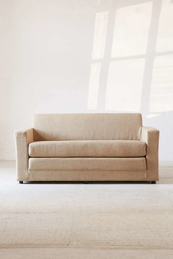 This <a href="https://www.urbanoutfitters.com/shop/anywhere-sleeper-sofa?category=sofas&amp;color=014&amp;quantity=1&amp;size=ONE%20SIZE&amp;type=REGULAR" target="_blank">compact, affordable couch</a> is perfect for accommodating guests or just lounging around.