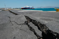 <p>Cracks are seen at the main port on the island of Kos on July 21, 2017, following a 6.5 magnitude earthquake which struck the region. (Phot: Louisa Gouliamaki/AFP/Getty Images) </p>