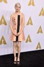 <p>Michelle Williams looked as elegant as ever in a custom Louis Vuitton silk dress. Not many of us could pull off this peachy hue, but Michelle with her peroxide pixie crop did it effortlessly. [Photo: Getty] </p>