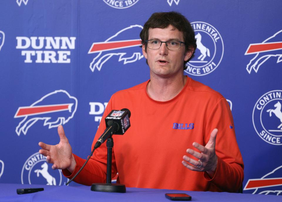 Bills offensive coordinator Ken Dorsey speaks with the media before an OTA session. 