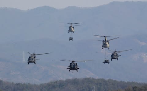 U.S. Army's Blackhawk and Chinook helicopters fly during a combined arms live-fire exercise during the annual joint military exercise Foal Eagle - Credit: AP