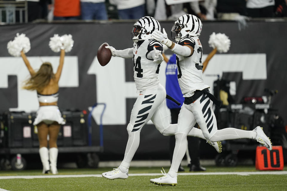 Cincinnati Bengals' Vonn Bell (24) celebrates an interception with Jessie Bates III (30) during the first half of an NFL football game against the Miami Dolphins, Thursday, Sept. 29, 2022, in Cincinnati. (AP Photo/Joshua A. Bickel)