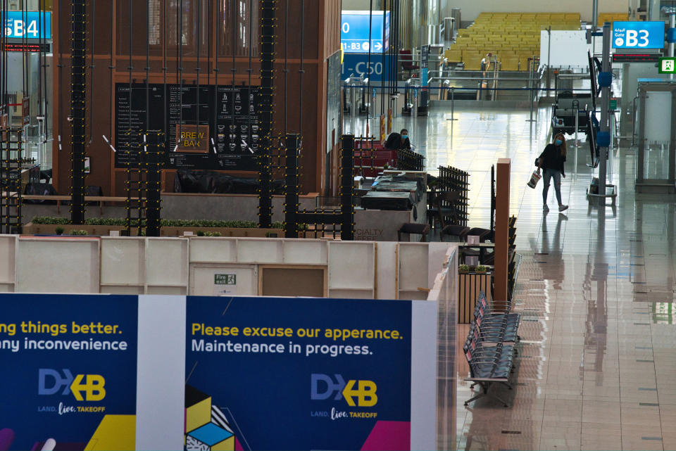 Dubai International Airport's Terminal 3, typically buzzing with passengers, stands largely empty in Dubai, United Arab Emirates, Wednesday, June 10, 2020. The coronavirus pandemic has hit global aviation hard, particularly at Dubai International Airport, the world's busiest for international travel, due to restrictions on global movement over the virus. (AP Photo/Jon Gambrell)